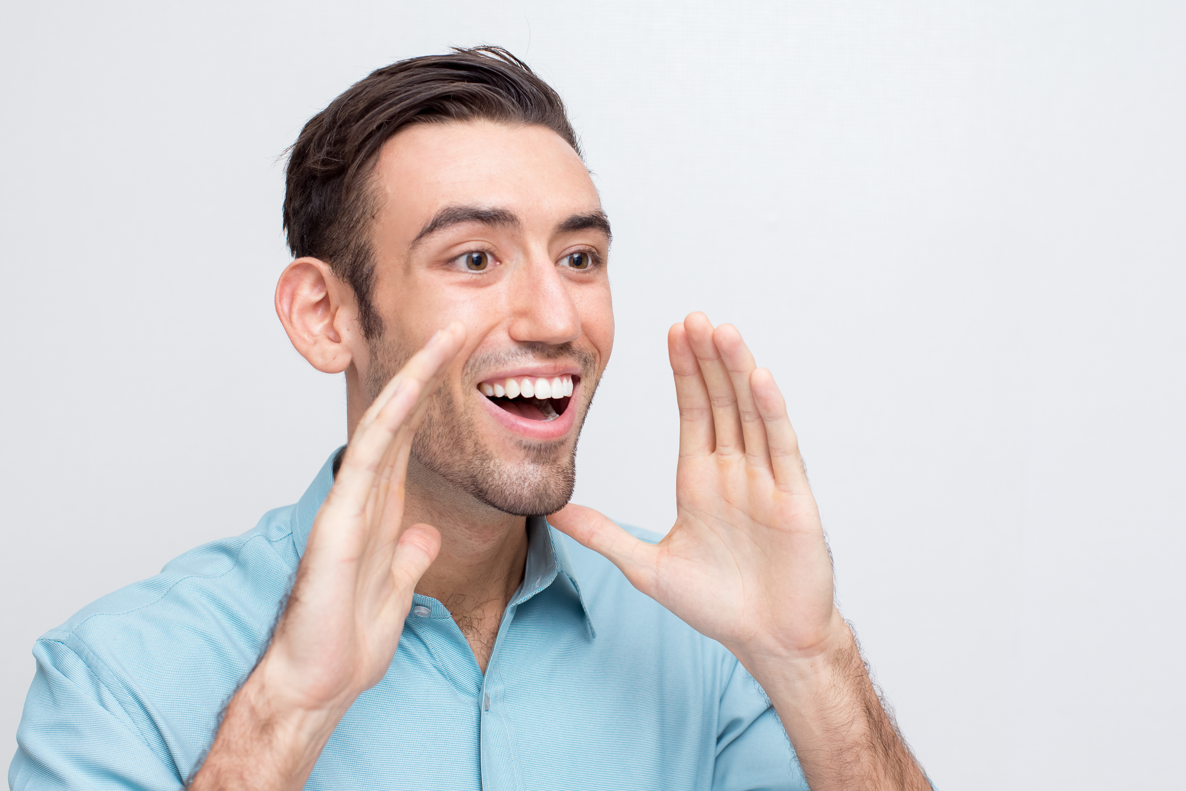 Man pointing to happy smile